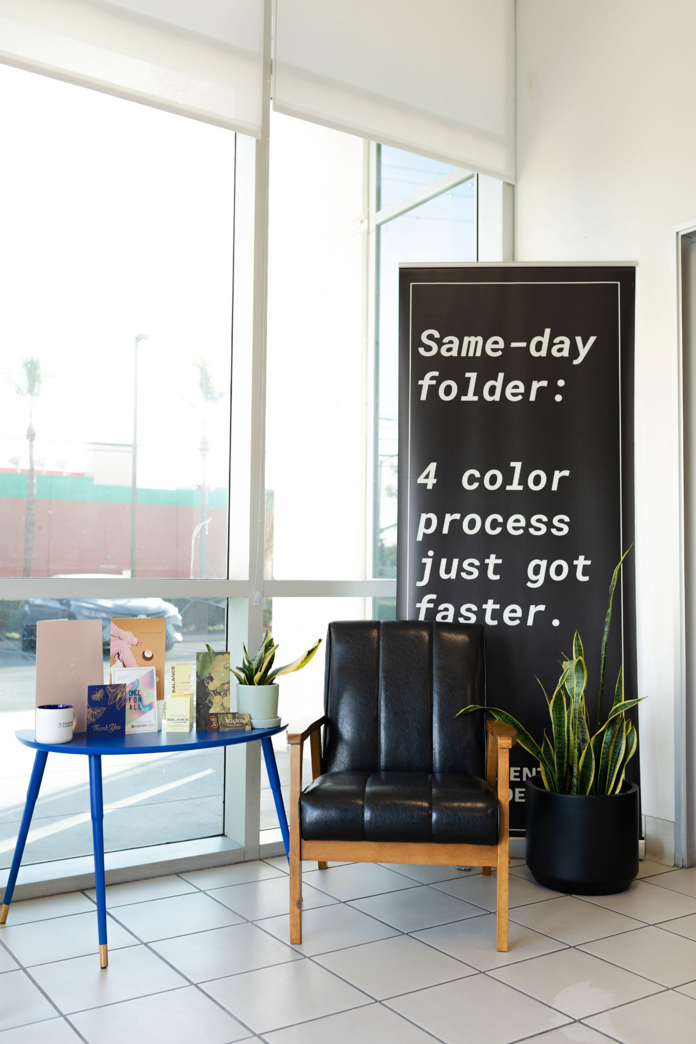 PFI lobby display promoting same-day four color process work